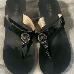 Michael Kors Black Patent Thong Sandals with Gold MK Medallions